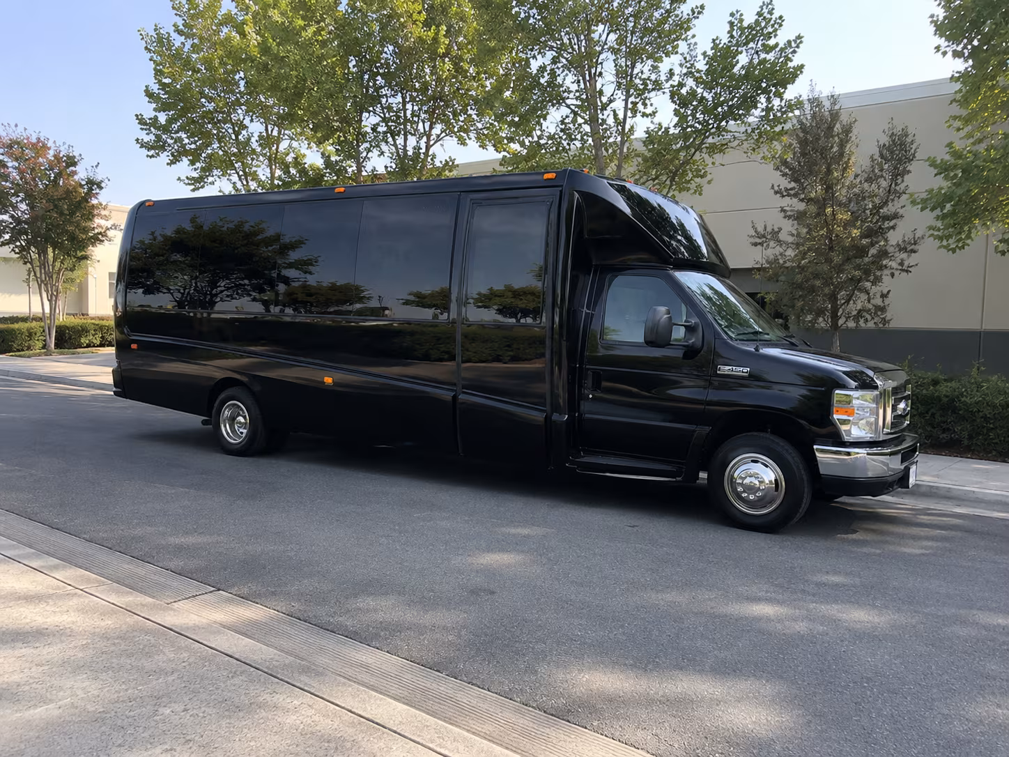 Friends laughing during a party bus celebration in Hillsboro